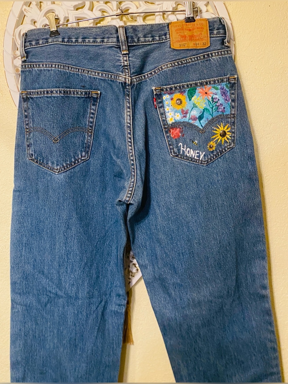 Vintage Levi'  550s in Blue with hand painted floral pockets